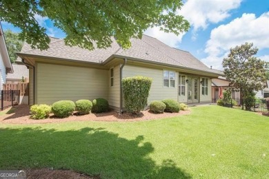 Step into luxury at this 4-bedroom, 4-bathroom cottage in Newnan on Summergrove Golf Club in Georgia - for sale on GolfHomes.com, golf home, golf lot