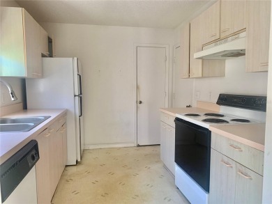 Welcome to your cozy and charming 2 bedroom, 2 bath home in the on Tierra Del Sol Golf and Country Club in Florida - for sale on GolfHomes.com, golf home, golf lot