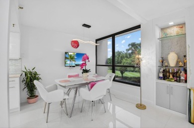Discover luxury living in this beautifully renovated condo at on Boca West Golf and Country Club in Florida - for sale on GolfHomes.com, golf home, golf lot