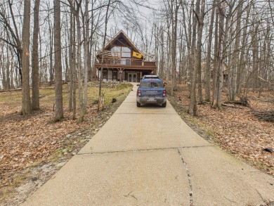 Welcome to this delightful 3-bedroom, 2-bath chalet packed with on Michaywe Pines Course in Michigan - for sale on GolfHomes.com, golf home, golf lot