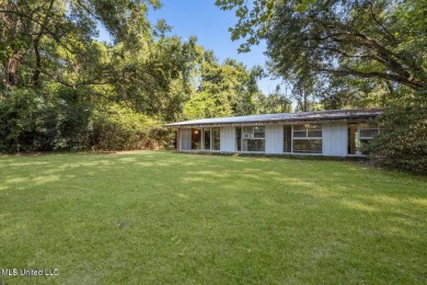 Built by Carroll Ishee in 1960 this home retains it's cork on Gulf Hills Golf Club in Mississippi - for sale on GolfHomes.com, golf home, golf lot