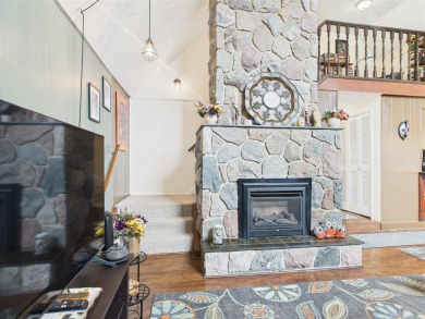 Welcome to this delightful 3-bedroom, 2-bath chalet packed with on Michaywe Pines Course in Michigan - for sale on GolfHomes.com, golf home, golf lot
