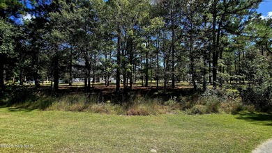 Tucked at the end of a peaceful cul-de-sac, this spacious on Ocean Ridge Plantation in North Carolina - for sale on GolfHomes.com, golf home, golf lot