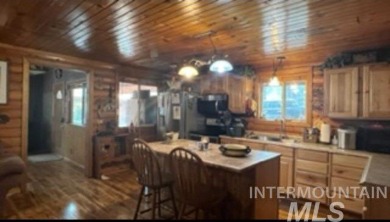 Motivated Seller! Log cabin with many improvements through the on Terrace Lakes Golf Resort in Idaho - for sale on GolfHomes.com, golf home, golf lot