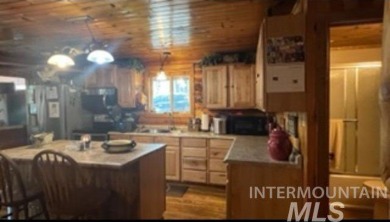 Motivated Seller! Log cabin with many improvements through the on Terrace Lakes Golf Resort in Idaho - for sale on GolfHomes.com, golf home, golf lot