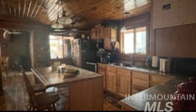 Motivated Seller! Log cabin with many improvements through the on Terrace Lakes Golf Resort in Idaho - for sale on GolfHomes.com, golf home, golf lot