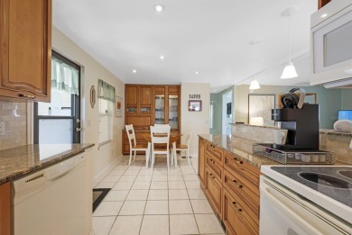Sassy and charming 2 bedroom, 2 full bath home in award-winning on Maple Leaf Golf and Country Club in Florida - for sale on GolfHomes.com, golf home, golf lot