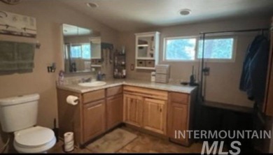 Motivated Seller! Log cabin with many improvements through the on Terrace Lakes Golf Resort in Idaho - for sale on GolfHomes.com, golf home, golf lot