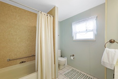 Sassy and charming 2 bedroom, 2 full bath home in award-winning on Maple Leaf Golf and Country Club in Florida - for sale on GolfHomes.com, golf home, golf lot