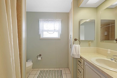 Sassy and charming 2 bedroom, 2 full bath home in award-winning on Maple Leaf Golf and Country Club in Florida - for sale on GolfHomes.com, golf home, golf lot