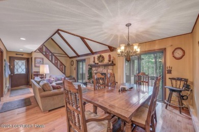Discover the perfect blend of comfort and charm in this on Lake Naomi Timber Trails Golf Club in Pennsylvania - for sale on GolfHomes.com, golf home, golf lot