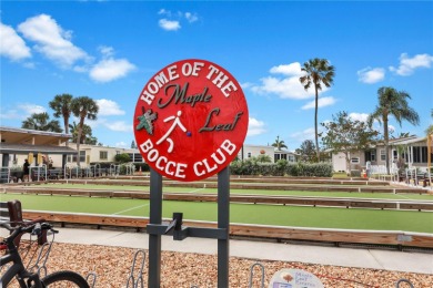 Sassy and charming 2 bedroom, 2 full bath home in award-winning on Maple Leaf Golf and Country Club in Florida - for sale on GolfHomes.com, golf home, golf lot