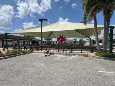 Sassy and charming 2 bedroom, 2 full bath home in award-winning on Maple Leaf Golf and Country Club in Florida - for sale on GolfHomes.com, golf home, golf lot