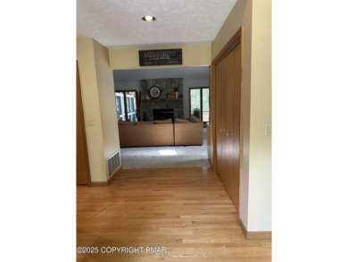 A must-see spacious home nestled in the gated Timber Trails on Lake Naomi Timber Trails Golf Club in Pennsylvania - for sale on GolfHomes.com, golf home, golf lot