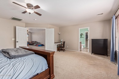 This spacious 3-bedroom, 2.5-bath home offers 2,440 sqft of on The Golf Club At Johnson Ranch in Arizona - for sale on GolfHomes.com, golf home, golf lot