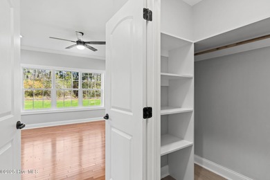 Stunning custom 3 bedroom, 3 bathroom plus a bonus room home in on Carolina Shores Golf Course in North Carolina - for sale on GolfHomes.com, golf home, golf lot