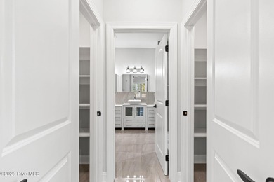 Stunning custom 3 bedroom, 3 bathroom plus a bonus room home in on Carolina Shores Golf Course in North Carolina - for sale on GolfHomes.com, golf home, golf lot