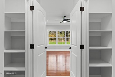 Stunning custom 3 bedroom, 3 bathroom plus a bonus room home in on Carolina Shores Golf Course in North Carolina - for sale on GolfHomes.com, golf home, golf lot