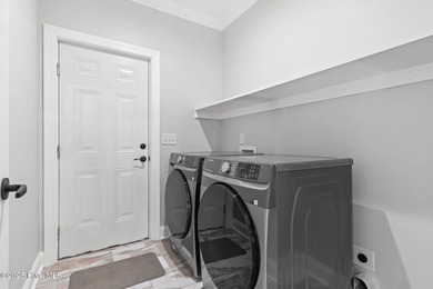 Stunning custom 3 bedroom, 3 bathroom plus a bonus room home in on Carolina Shores Golf Course in North Carolina - for sale on GolfHomes.com, golf home, golf lot