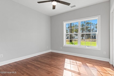 Stunning custom 3 bedroom, 3 bathroom plus a bonus room home in on Carolina Shores Golf Course in North Carolina - for sale on GolfHomes.com, golf home, golf lot