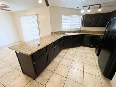 Close to the golf course. This charming home with plenty of on London Bridge Golf Course in Arizona - for sale on GolfHomes.com, golf home, golf lot
