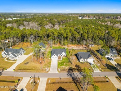 Stunning custom 3 bedroom, 3 bathroom plus a bonus room home in on Carolina Shores Golf Course in North Carolina - for sale on GolfHomes.com, golf home, golf lot