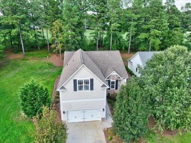 Enjoy true lock and go living in this beautiful gated, lakefront on The Patriot Golf Club At Grand Harbor in South Carolina - for sale on GolfHomes.com, golf home, golf lot