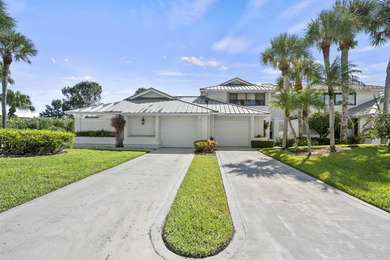 Spacious lakefront golf villa with 3 bedrooms, 2.5 bathrooms on Mariner Sands Country Club in Florida - for sale on GolfHomes.com, golf home, golf lot