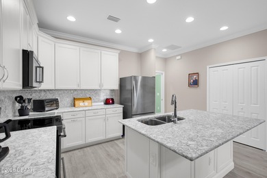 Experience the ultimate waterfront lifestyle in this on LPGA International Golf Course in Florida - for sale on GolfHomes.com, golf home, golf lot