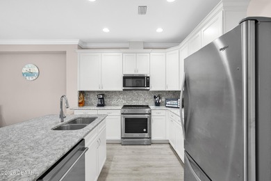 Experience the ultimate waterfront lifestyle in this on LPGA International Golf Course in Florida - for sale on GolfHomes.com, golf home, golf lot