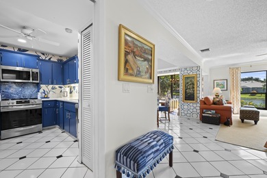 Spacious lakefront golf villa with 3 bedrooms, 2.5 bathrooms on Mariner Sands Country Club in Florida - for sale on GolfHomes.com, golf home, golf lot