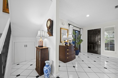 Spacious lakefront golf villa with 3 bedrooms, 2.5 bathrooms on Mariner Sands Country Club in Florida - for sale on GolfHomes.com, golf home, golf lot