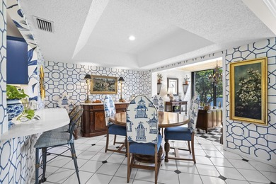 Spacious lakefront golf villa with 3 bedrooms, 2.5 bathrooms on Mariner Sands Country Club in Florida - for sale on GolfHomes.com, golf home, golf lot