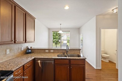 Step into sophistication with this beautifully designed End-Unit on Country Club of the Poconos Golf Course in Pennsylvania - for sale on GolfHomes.com, golf home, golf lot