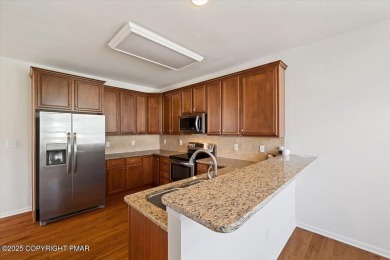 Step into sophistication with this beautifully designed End-Unit on Country Club of the Poconos Golf Course in Pennsylvania - for sale on GolfHomes.com, golf home, golf lot