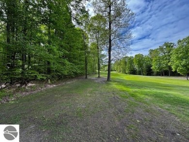 Go beyond the gated entrance, where a wooded winding drive on  in Michigan - for sale on GolfHomes.com, golf home, golf lot