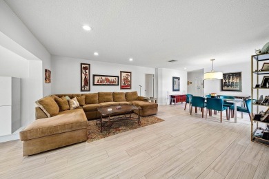 Enjoy beautiful golf course views from this bright and airy on  in Florida - for sale on GolfHomes.com, golf home, golf lot