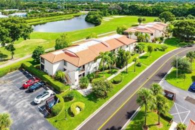 Enjoy beautiful golf course views from this bright and airy on  in Florida - for sale on GolfHomes.com, golf home, golf lot