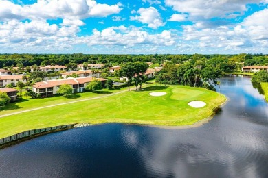 Enjoy beautiful golf course views from this bright and airy on  in Florida - for sale on GolfHomes.com, golf home, golf lot