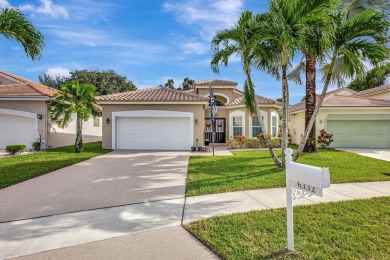 Exceptional home privately nestled within the gated community of on Atlantic National Golf and Country Club in Florida - for sale on GolfHomes.com, golf home, golf lot