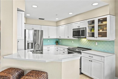 A SPECIAL UNIT WITH STUNNING LAKE VIEWS and NO FLOOD DAMAGE from on Bonita Bay West in Florida - for sale on GolfHomes.com, golf home, golf lot