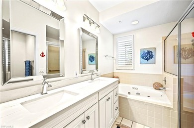 A SPECIAL UNIT WITH STUNNING LAKE VIEWS and NO FLOOD DAMAGE from on Bonita Bay West in Florida - for sale on GolfHomes.com, golf home, golf lot