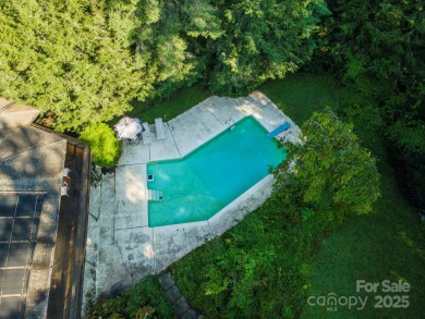 A rare opportunity awaits you in this secluded gem. You can live on Biltmore Forest Country Club in North Carolina - for sale on GolfHomes.com, golf home, golf lot