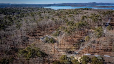 Discover your dream retreat on the picturesque shores of Greers on Thunderbird Country Club in Arkansas - for sale on GolfHomes.com, golf home, golf lot