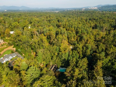 A rare opportunity awaits you in this secluded gem. You can live on Biltmore Forest Country Club in North Carolina - for sale on GolfHomes.com, golf home, golf lot