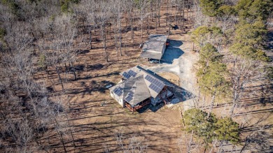 Discover your dream retreat on the picturesque shores of Greers on Thunderbird Country Club in Arkansas - for sale on GolfHomes.com, golf home, golf lot