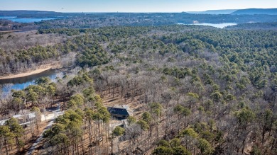 Discover your dream retreat on the picturesque shores of Greers on Thunderbird Country Club in Arkansas - for sale on GolfHomes.com, golf home, golf lot