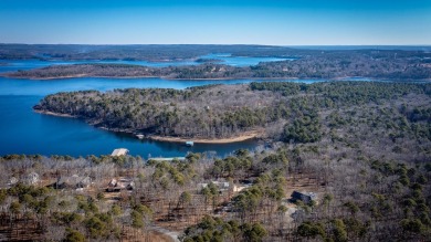 Discover your dream retreat on the picturesque shores of Greers on Thunderbird Country Club in Arkansas - for sale on GolfHomes.com, golf home, golf lot