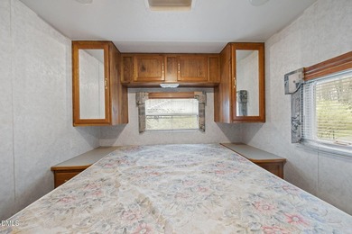 START LIVING THE LAKE LIFE NOW!! WATERFRONT GET-AWAY WITH 75 FT on River Golf and Country Club at Lake Royale in North Carolina - for sale on GolfHomes.com, golf home, golf lot