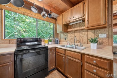 This LAKEFRONT chalet sits right on the very sought after on Innsbrook Resort Golf Course in Missouri - for sale on GolfHomes.com, golf home, golf lot